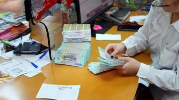 Bà L. đến ngân hàng rút 325 triệu tiền tiết kiệm, nhân viên Agribank thực hiện giao dịch rồi lập tức báo công an