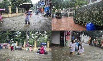 Thủ đô ngập lụt chưa từng có: Quân đội điều xe cứu trợ, phụ huynh bì bõm cõng con tan trường