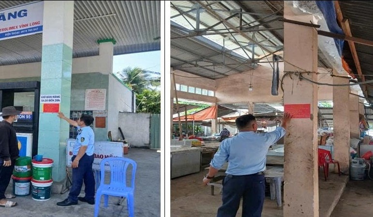 Số điện thoại đường dây nóng của Quản lý thị trường Vĩnh Long được dán tại các cây xăng, chợ để tiếp nhận phản ánh liên quan giá cả, nguồn cung, chất lượng... hàng hóa. vl.jpg