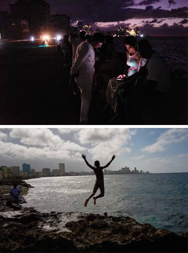 Trên: Người dân qua đêm trong bóng tối trên đại lộ Malecon trong thời gian mất điện ở Havana, Cuba, ngày 21/3/2026. Dưới: Một thanh niên nhảy xuống biển tắm trong thời gian mất điện ở Havana, ngày 4/3/2026. Ảnh: Getty Images. Cuba cảnh báo mức đe dọa quân sự chưa từng có từ Mỹ - Ảnh 3.