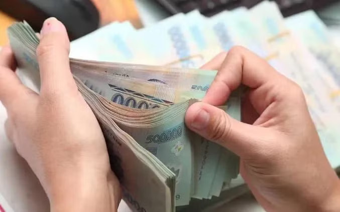 Trả lương thấp hơn mức tối thiểu, doanh nghiệp bị phạt ra sao? - Ảnh 1.
